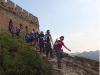 Group shot of trekkers exiting one of the many guard towers along the Great Wall |  <i>Victoria Earl</i>